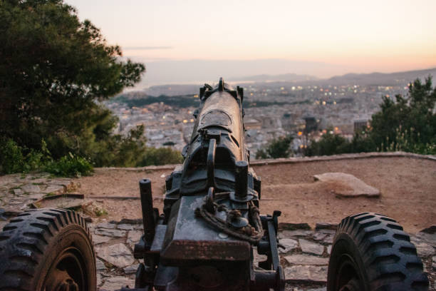 istock Modern cannon pointing at a city 1144631751