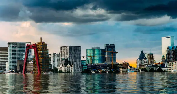 Digital manipulation of flooded Rotterdam, Netherlands downtown skyline - global warming concept