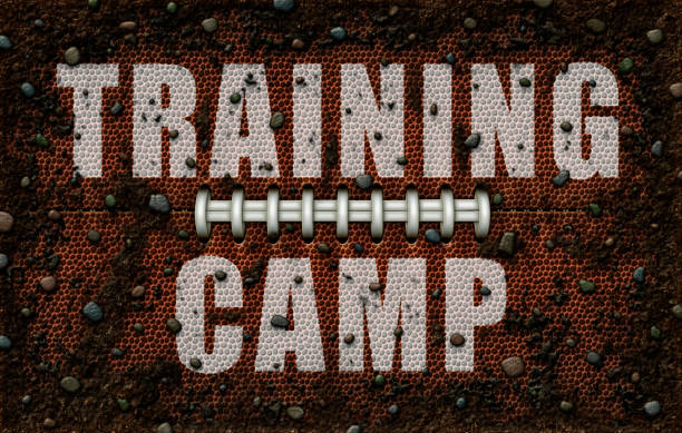 istock The words Training Camp embossed in white on a football texture with dirt and rocks. 3D Illustration 1144633598