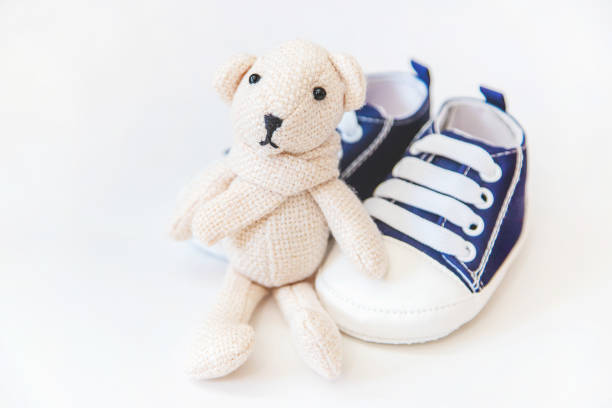 istock newborn. baby accessories on a light background. Selective focus. 1144633840