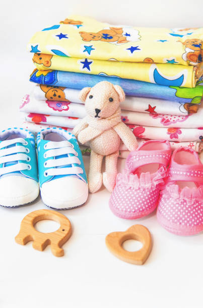 istock newborn. baby accessories on a light background. Selective focus. 1144633844