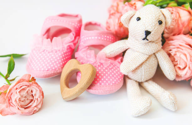 istock newborn. baby accessories on a light background. Selective focus. 1144633857