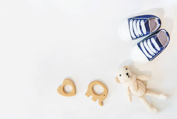 istock newborn. baby accessories on a light background. Selective focus. 1144633887
