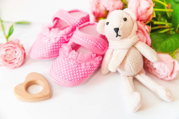 istock newborn. baby accessories on a light background. Selective focus. 1144633889