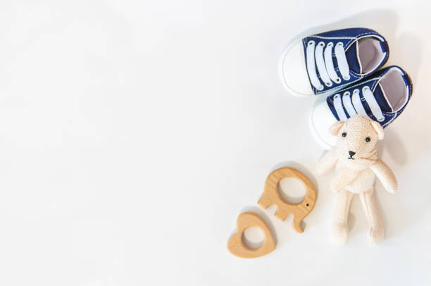 istock newborn. baby accessories on a light background. Selective focus. 1144633902