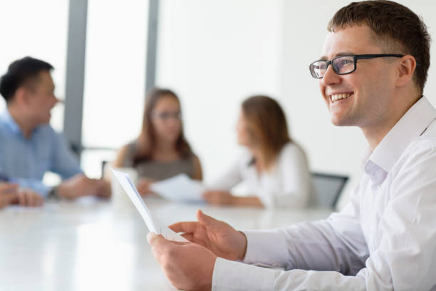 Businessman talking with colleague in office