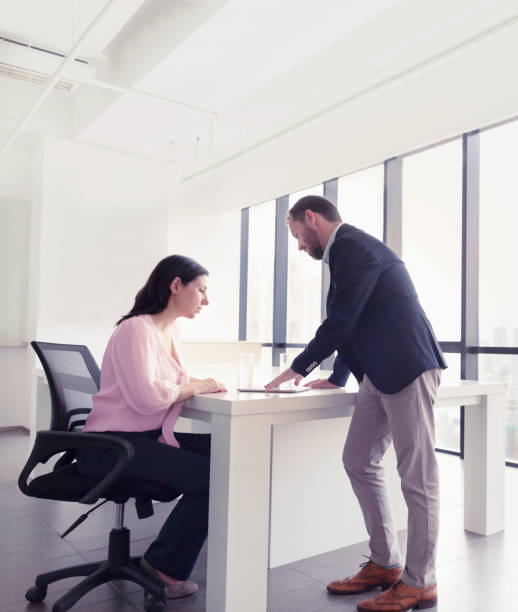 istock Co-workers discussing plans in urban office 1144635569