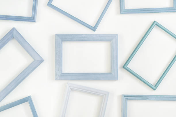 istock A lot of light blue empty frames are laid out on a white background. Space for text, layout. Unusual concept. 1144636286