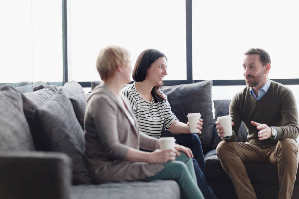 istock Office staff relaxing on coffee break discussing ideas 1144636333