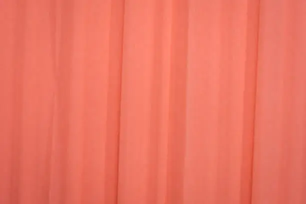 salmon color crepe paper - background with crinkled texture
