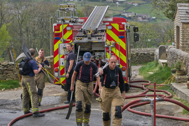 Firefighters attending moor fires in West Yorkshire stock photo