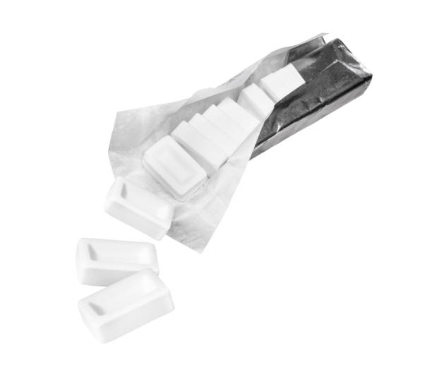 istock Refreshing candies fall out of the package, isolated on a white background 1144637877