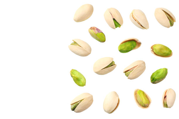 istock pistachio isolated on the white background. top view 1144637880