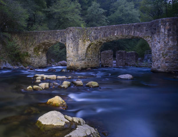 istock Leizaran river flows between the rocks under an old bridge in Andoain, Euskadi, Europe 1144638555