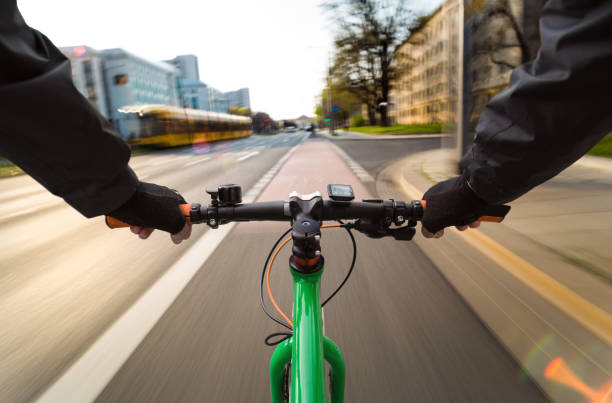 istock A cyclist and a tram ride down a street 1144639733