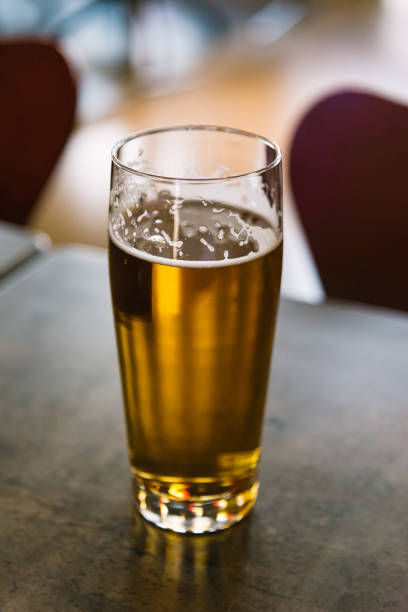 istock Glass of beer on table in a bar 1144640576