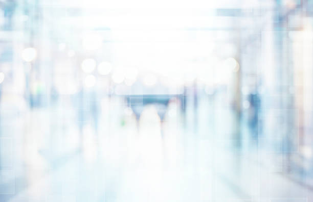 istock Abstract blurred interior of corridor clinic background in blue color , blurry image 1144642797