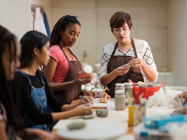 istock Professor and adult students in ceramic class 1144643770