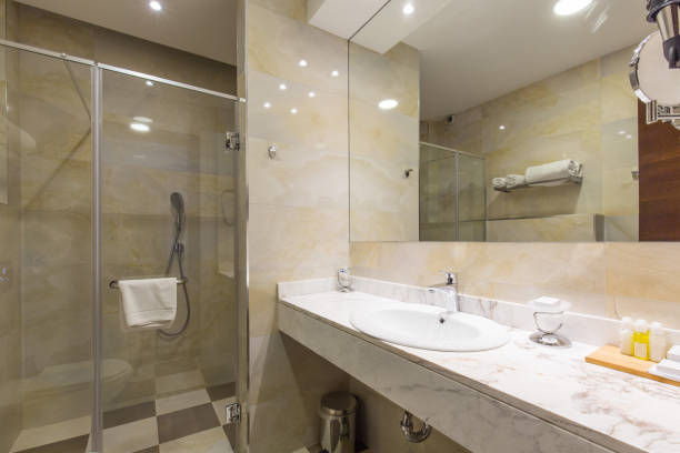 istock Hotel bathroom interior with shower cabin 1144644129