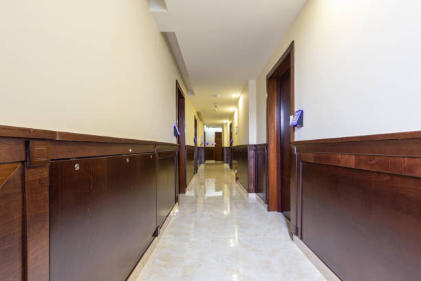 istock Long hotel corridor with marble floor 1144644261