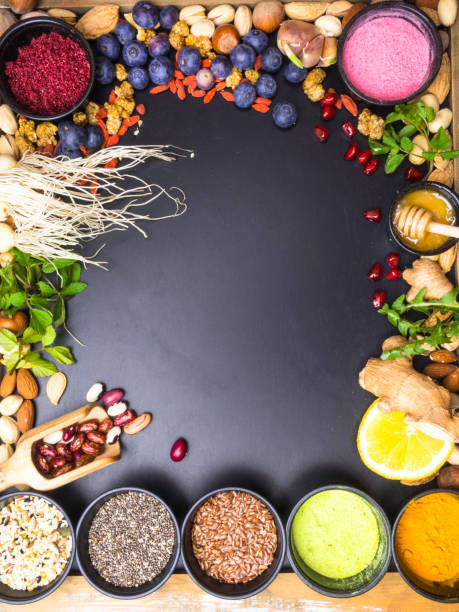 istock Superfoods on dark wooden table with space for text 1144645564