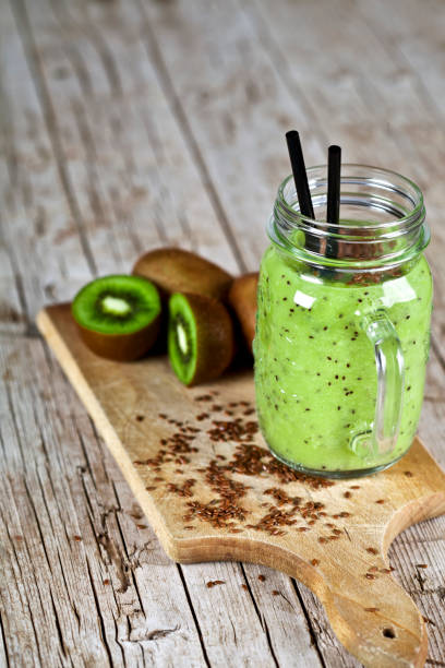 istock Green smoothie with kiwi, apple, lemon and linen seeds. 1144645897