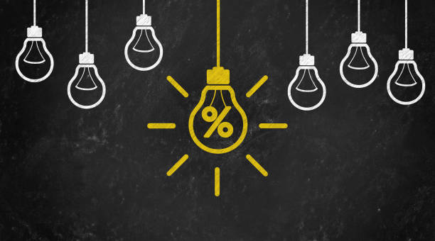 istock percentage Symbol with Bulb Concept Chalk Drawing on Blackboard 1144645909