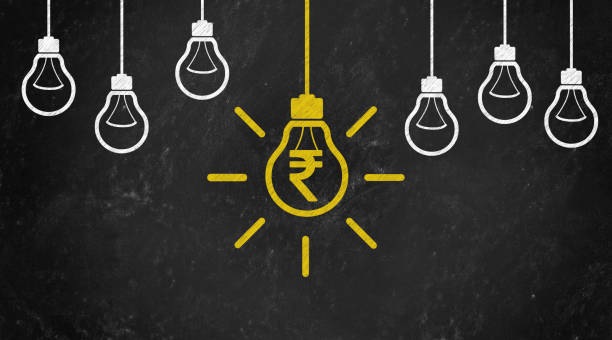 istock rupee Symbol with Bulb Concept Chalk Drawing on Blackboard 1144645990
