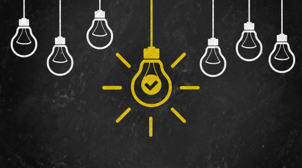 istock ok or check Symbol with Bulb Concept Chalk Drawing on Blackboard 1144646035