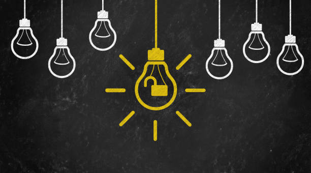 istock unlock Symbol with Bulb Concept Chalk Drawing on Blackboard 1144646208