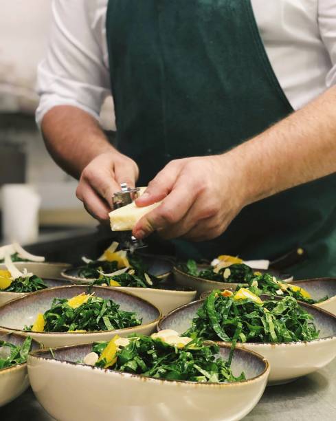 chef cooking in the industrial kitchen - prepared vegetable imagens e fotografias de stock