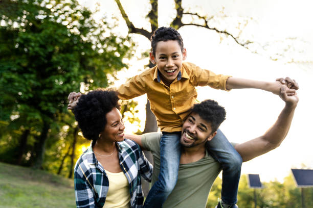 istock Young loving family having fun in the park 1144649536