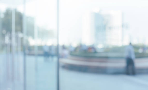 istock Blurred abstract glass wall from building in city town 1144649659