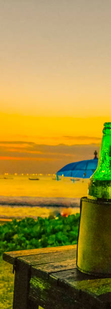 istock Vacation, sunset at the beach with a beer 1144652452