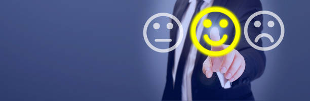 istock man touching smiley in customer satisfaction survey 1144653001