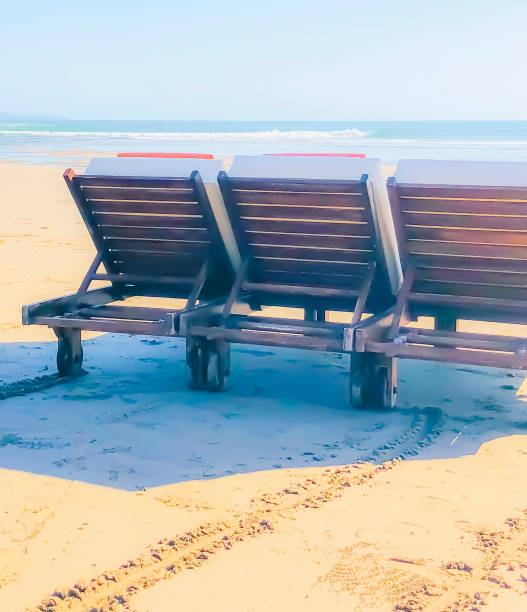 istock Beach lounge chairs on a paradise beach 1144655318