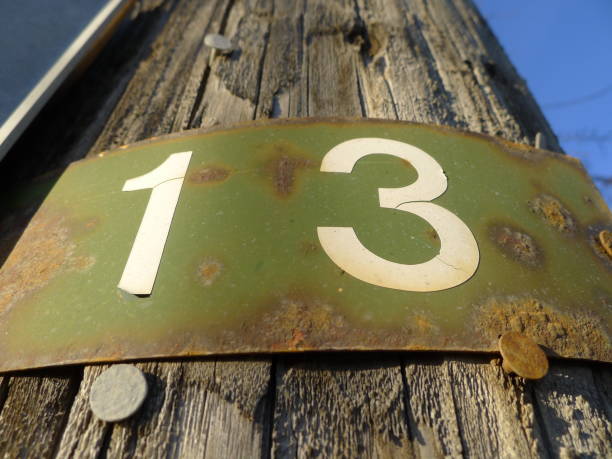 istock Rusted metal number thirteen sign 1144658435