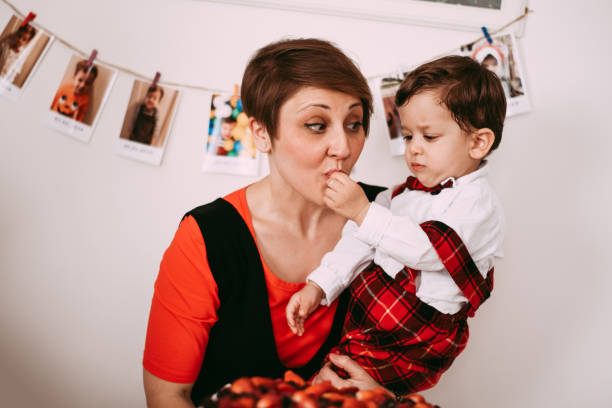 istock Mother celebrating her son's birthday at home 1144661904