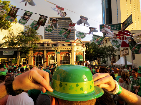 Honolulu -  March 17, 2013: Large crowd of people gather in street in Chinatown during St. Patrick's Day Block Party.