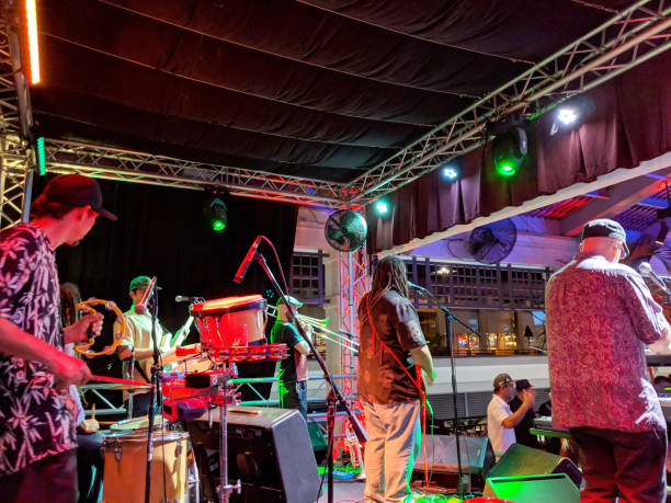 Guidance Band, singing and jams on stage at Mai Tai Bar Honolulu - March 8, 2019: Guidance Band, singing, play music, and jams on stage at Mai Tai Bar in Ala Moana Shopping Center. reggae band stock pictures, royalty-free photos & images