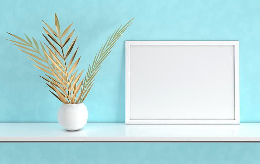 Poster frame mockup with gold palm leaves in the vase on blue background. Front view photo frame on white book shelf or desk. Digitally generated, 3d render interior