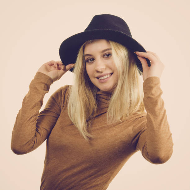 istock Woman wearing suede and black hat 1144664574