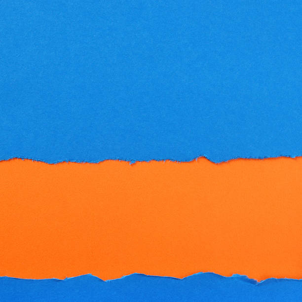istock Torn blue paper strip orange background border frame 1144665126