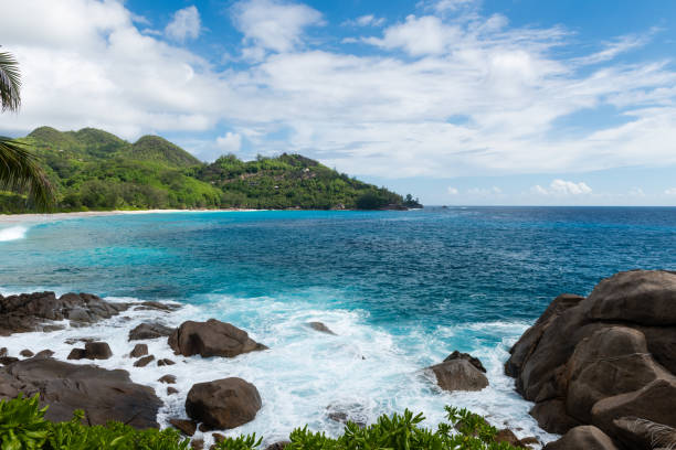 istock Wild Seychelles lagoon with rocks and greens 1144666448