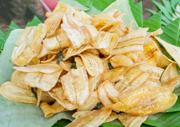 istock Fried banana slice crispy with sugar on banana leaf background 1144671156