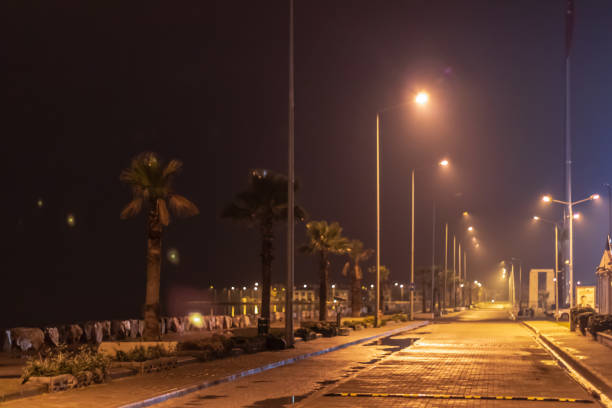 istock a wide view from a coastal road - city lights 1144676121