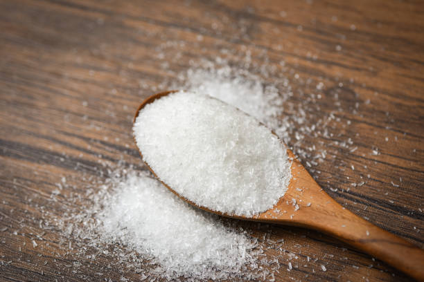 istock Monosodium glutamate on wooden spoon on rustic wood background / MSG 1144677205
