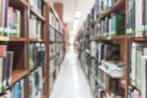 istock Blur school library or study room with book shelves for education background 1144679027