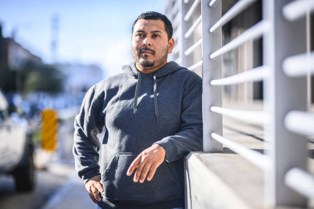 istock Thoughtful man leaning on railing in the city 1144679430
