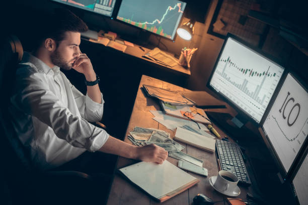istock Young male trader at office work concept Initial Coin Offering 1144679458